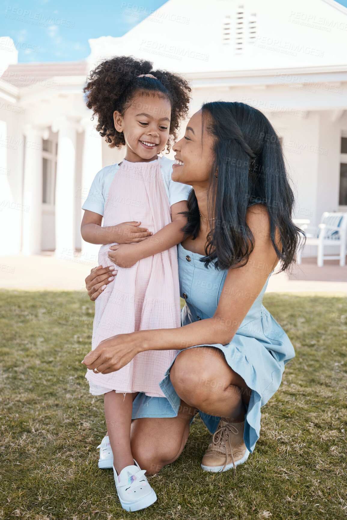 Buy stock photo Mother, smile and hug girl outdoor at home backyard, bonding and having fun. Happy, daughter and mom embrace with child for love, care for kid and enjoying quality time together on holiday vacation.