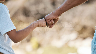 Buy stock photo Support, love and father and child with fist bump for motivation, care and trust in nature. Family, collaboration and hands of dad and kid together for community, cooperation or achievement in a park