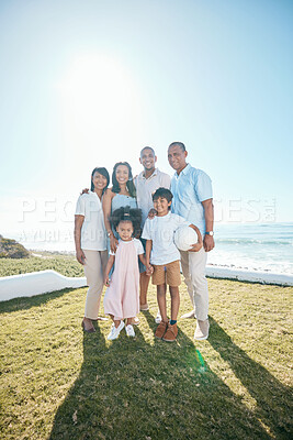 Buy stock photo Family, portrait and outdoors with happiness in nature with ball in mockup space with children. Happy, parents and generations are standing in garden or summer for bond or quality time together.