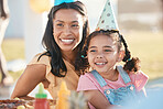 Party, outdoor and mother with girl, birthday and celebration with happiness, event and cheerful. Mama, daughter or female child with a happy parent, food and gifts with party, park and joy with hats