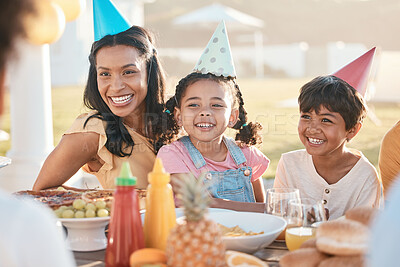 Buy stock photo Happy family at lunch or a party in nature for a birthday, celebration or barbecue in summer. Laughing, together and a mother with children at a table in a park, eating and at an event with food