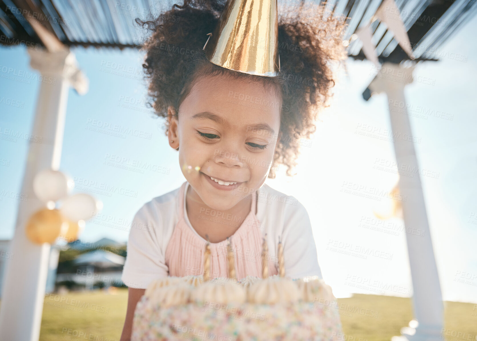 Buy stock photo Girl, smile and happy birthday with cake in garden for special event with hat or balloons. Party, dessert and candles for celebration with happiness in outdoor at house in summer for milestone.
