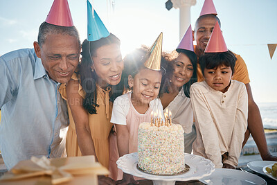 Birthday cake, children and senior family in summer for group celebration, party and grandparents love and care. Happy latino people with kids or girl celebrate on outdoor patio, holiday and candles