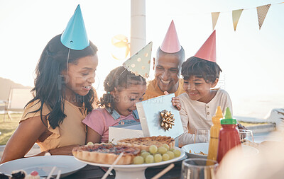 Buy stock photo Birthday, surprise and family outdoors for party, celebration and present, happy and excited. Parents, children and gift for girl child at special event, wow and celebrating with food at restaurant 