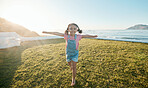 Happy, freedom and portrait of girl in park with big smile excited for playing, flying and adventure. Childhood, happiness and young child running on grass for playing, relaxing and fun in nature