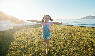 Buy stock photo Happy, freedom and portrait of girl in park with open arms, excited for playing, flying and adventure. Smile, happiness and young child running on grass for holiday, relaxing and fun in nature