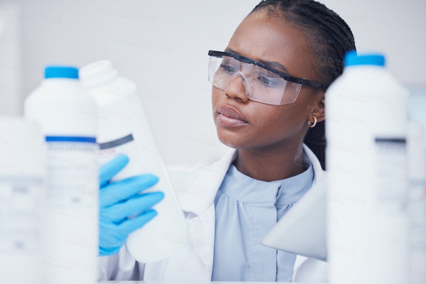 Buy stock photo Label check tablet, chemical bottle and black woman scientist with mask at pharmaceutical lab. Research, digital reading and science of a female worker with manufacturing job and chemistry inventory 