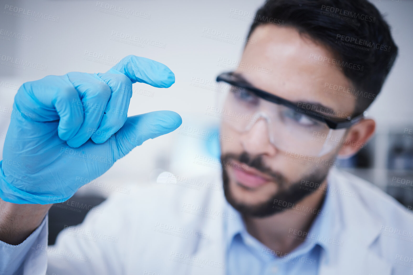 Buy stock photo Laboratory, man or hand of scientist with small size for research, assessment or experiment innovation. Healthcare, science blur or biologist with little scale gesture for future development results