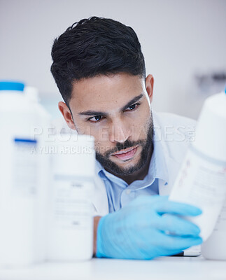 Buy stock photo Laboratory, man or scientist reading bottle to check medical stock or info on cure breakthrough. Research study, container label or science researcher in manufacturing job with chemical inventory