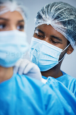 Buy stock photo Surgery, preparation and doctor team getting ready in hospital for medical, innovation and operation. Healthcare, experts and woman with man in theater for uniform, teamwork and medical collaboration