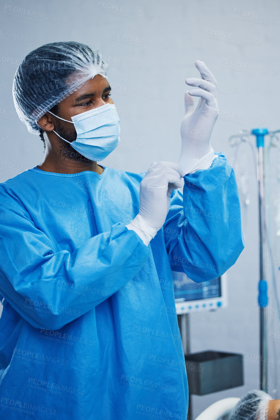 Buy stock photo Doctor in surgery, man in healthcare and surgical procedure start with PPE for safety in operation theatre in hospital. Medical professional, health insurance and male surgeon in protection gear