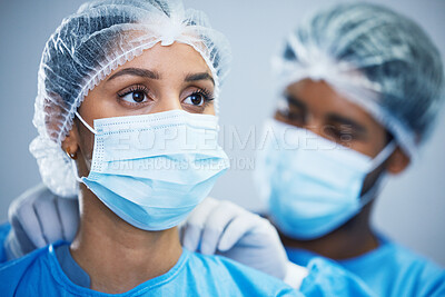 Buy stock photo Uniform, preparation and doctor team getting ready in hospital for medical, innovation and operation. Healthcare, experts and woman with man in theater for surgery, teamwork and medical collaboration