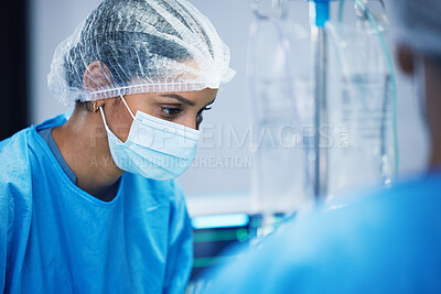 Buy stock photo Theatre, team and surgeon woman or doctors of medical support, hospital or healthcare solution in face mask. Focus, thinking and nurses in surgery, operating room and emergency or life insurance help