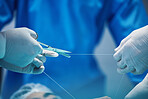 Surgery, hands and doctor cutting thread, stitching patient and surgical procedure with health insurance. People in medicine, surgeon with scissors and medical tools with collaboration in hospital