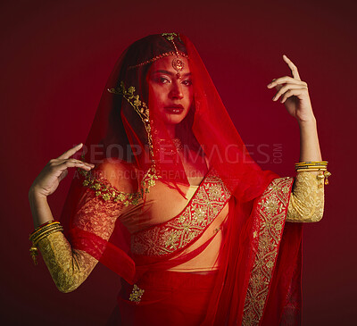 Buy stock photo Fashion, beauty and portrait of Indian woman with veil in traditional clothes, jewellery and sari. Religion, culture and face of female person on red background with accessory, cosmetics and makeup