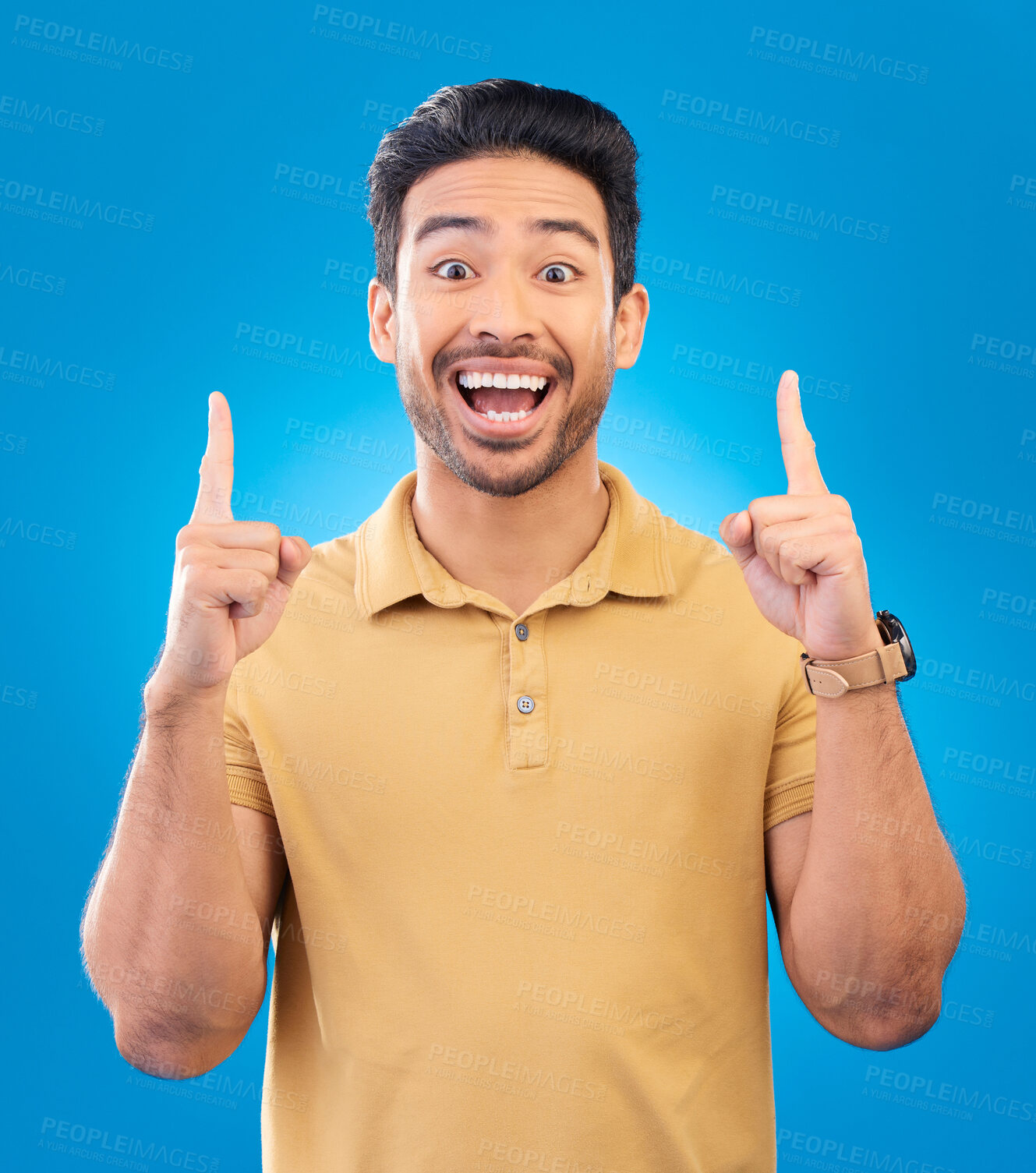Buy stock photo Wow, portrait and man pointing to presentation, news or announcement for creative opportunity. Show, information and happy asian person or model for startup idea or solution on studio blue background