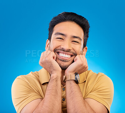 Buy stock photo Happy, excited man and cute smile portrait in studio with Asian model with teeth and joy. Blue background, male person and casual fashion with handsome and friendly guy with modern style and wow face.