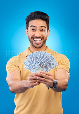 Buy stock photo Happy, portrait of a man with money fan and in a blue background for financial freedom. Rich or cash, investment or budget and male person pose for economy growth or winner in a studio backdrop