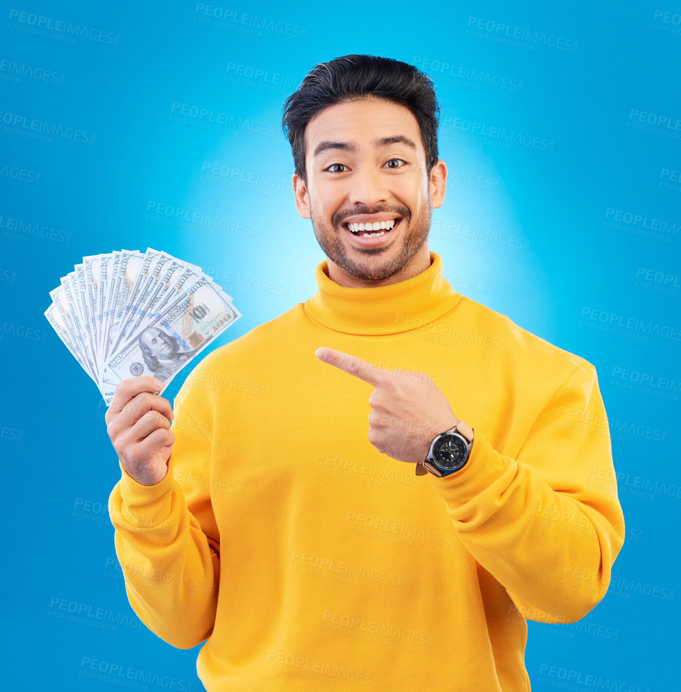 Buy stock photo Money, studio portrait and happy man point at dollar bills, competition reward or bonus salary prize. Savings pay, cash winner and excited person show income, success or wealth on blue background