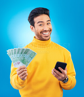 Buy stock photo Cash, money and portrait of Asian man with phone in studio for online bonus, competition and lottery. Success, finance and male person on blue background excited for promotion, winning and deal