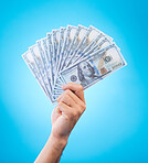 Money, studio hands and person show dollar bills, reward or bonus cash salary, profit or wealth. Financial pay increase, winning and rich winner with income, finance revenue or win on blue background