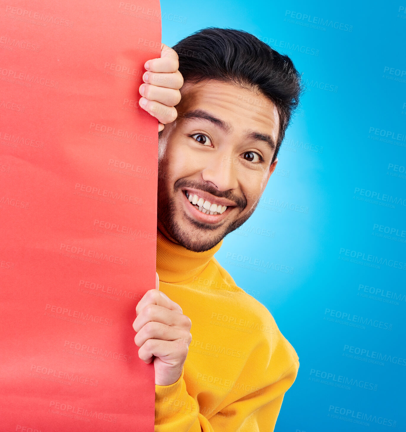 Buy stock photo Shock, peeking and portrait of man in studio with wow, omg or wtf facial expression by board with mockup. Hide, surprise and male model with happy face by poster with mock up space by blue background