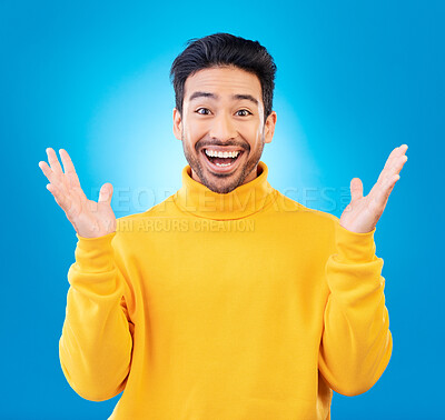 Buy stock photo Wow, excited man and surprise portrait in studio with Asian model with teeth and joy. Blue background, male person and casual fashion with handsome and friendly guy with modern style and happy
