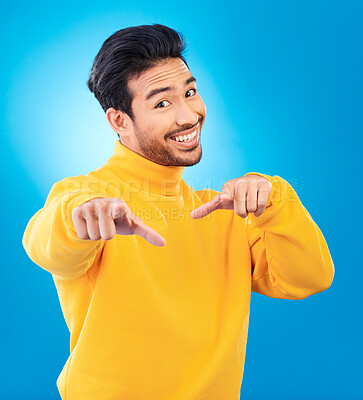 Buy stock photo Man, studio portrait and point at you with smile, choice and recruitment with fashion by blue background. Young Indian guy, gen z student and finger for decision, hiring and opportunity with clothes