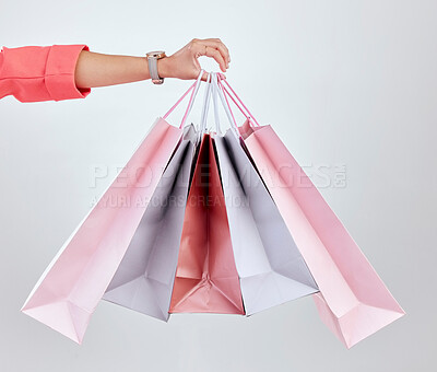 Buy stock photo Fashion, studio or hand of woman with shopping bags for retail sale, product offer or discount deal. Choice, customer or girl shopper holding gift, package or present on promotion on white background