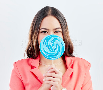 Buy stock photo Portrait, lollipop and woman with sweets, sugar and confident girl on a white studio background. Face, female person or model with candy, dessert and cover with treats, cheerful and confectionary