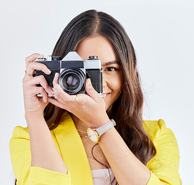Buy stock photo Creative, portrait and a woman with a camera for a photo, memory or career in photography. Happy, paparazzi and a young girl or photographer taking a picture isolated on a white background in studio