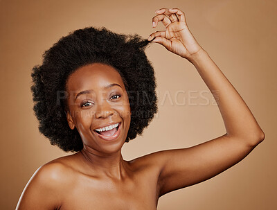 Buy stock photo Face, excited black woman and hair care for afro in studio isolated on a brown background. Portrait, hairstyle or happy African model with natural cosmetics after salon treatment for healthy wellness