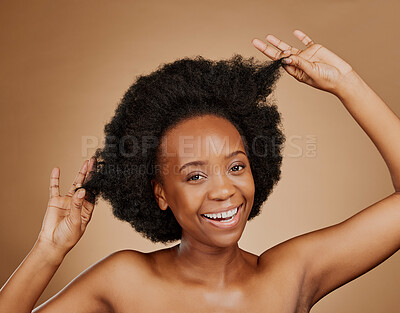 Buy stock photo Portrait, beauty and black woman pulling hair, cosmetics and wellness against a brown studio background. Face, female person and model with luxury, playful and volume with fun, texture and shampoo