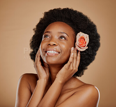 Buy stock photo Skincare, flower and young woman in studio with beauty, natural and wellness face routine. Cosmetic, health and African female model with floral rose in hair for facial treatment by brown background.