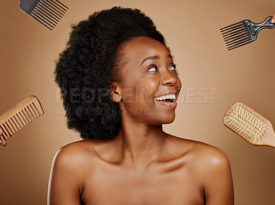 Buy stock photo Hair, comb and brush options with a black woman in studio on a brown background for beauty or cosmetics. Hairdresser, afro or haircare with hands at a style salon and an attractive young female model