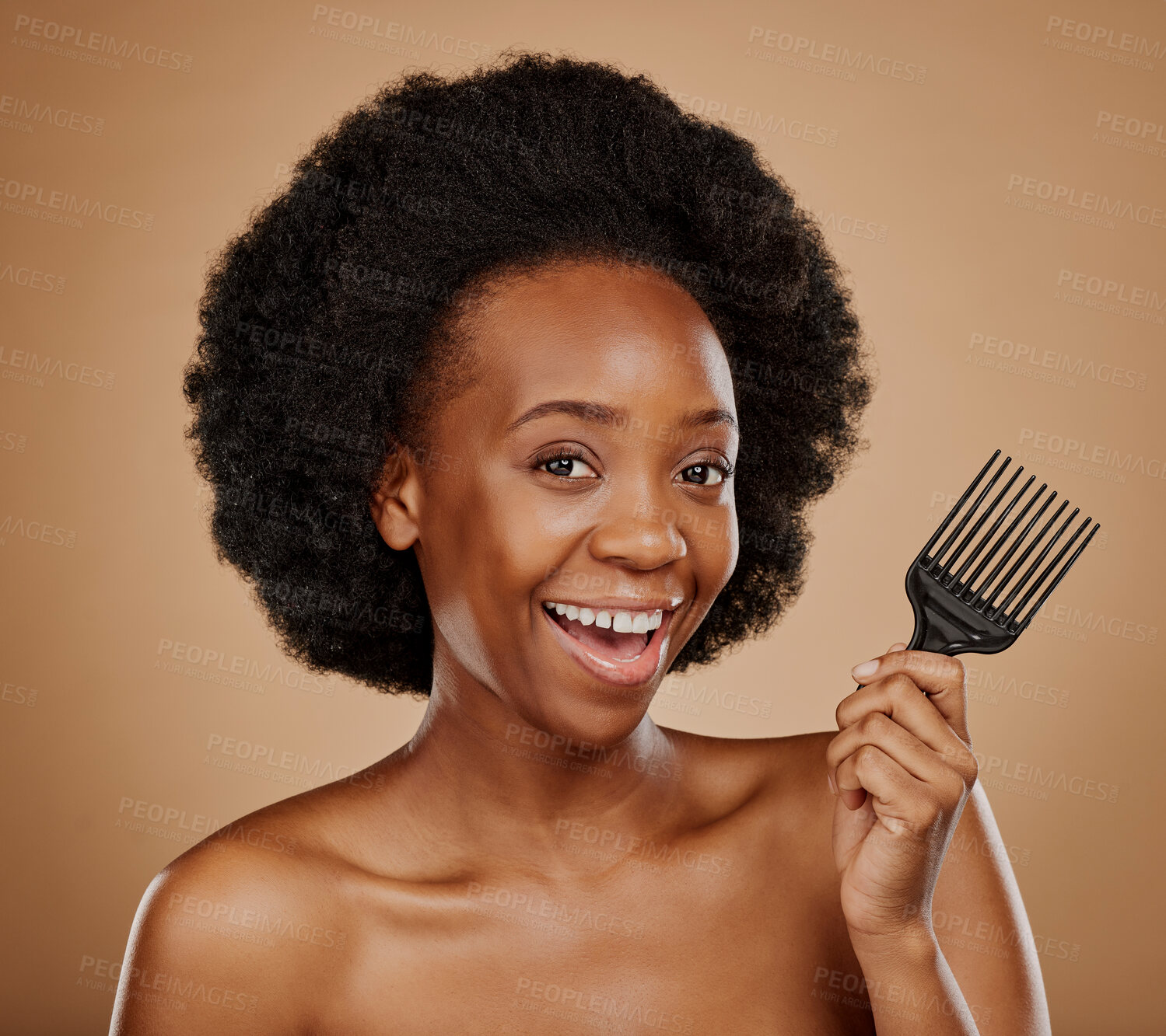 Buy stock photo Portrait, hair and comb with a model black woman in studio on a brown background for beauty or cosmetics. Smile, afro and haircare with a happy young female person looking excited for natural care