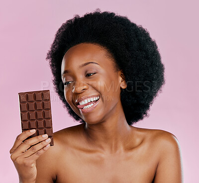 Buy stock photo Black woman, chocolate and diet with candy and beauty, health and dessert snack isolated on pink background. Skin, glow and happy female model with cacao sweets, calories and cosmetics in studio
