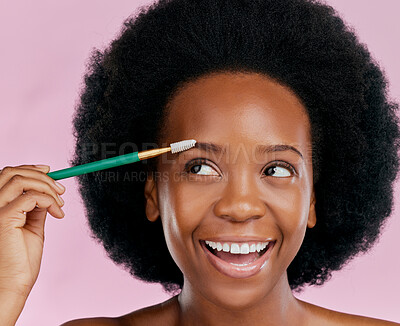 Buy stock photo Makeup, face and black woman with mascara, excited and beauty in studio isolated on a pink background. Brush, eyebrow cosmetics and happy African model apply facial treatment, wellness or aesthetic.