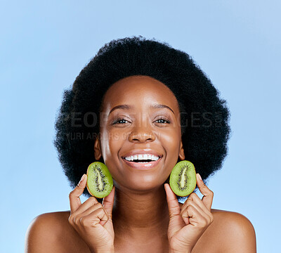Buy stock photo Skincare portrait, kiwi and woman for beauty, cosmetics and natural product, healthy glow and vitamin c promotion. Face of African person or model, fruits and dermatology on a studio, blue background