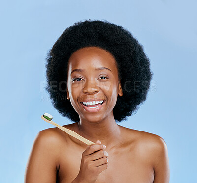 Buy stock photo Bamboo toothbrush, face and black woman excited in studio isolated on a blue background. Portrait, toothpaste and model with natural, eco friendly or healthy wood, dental hygiene and cleaning teeth.