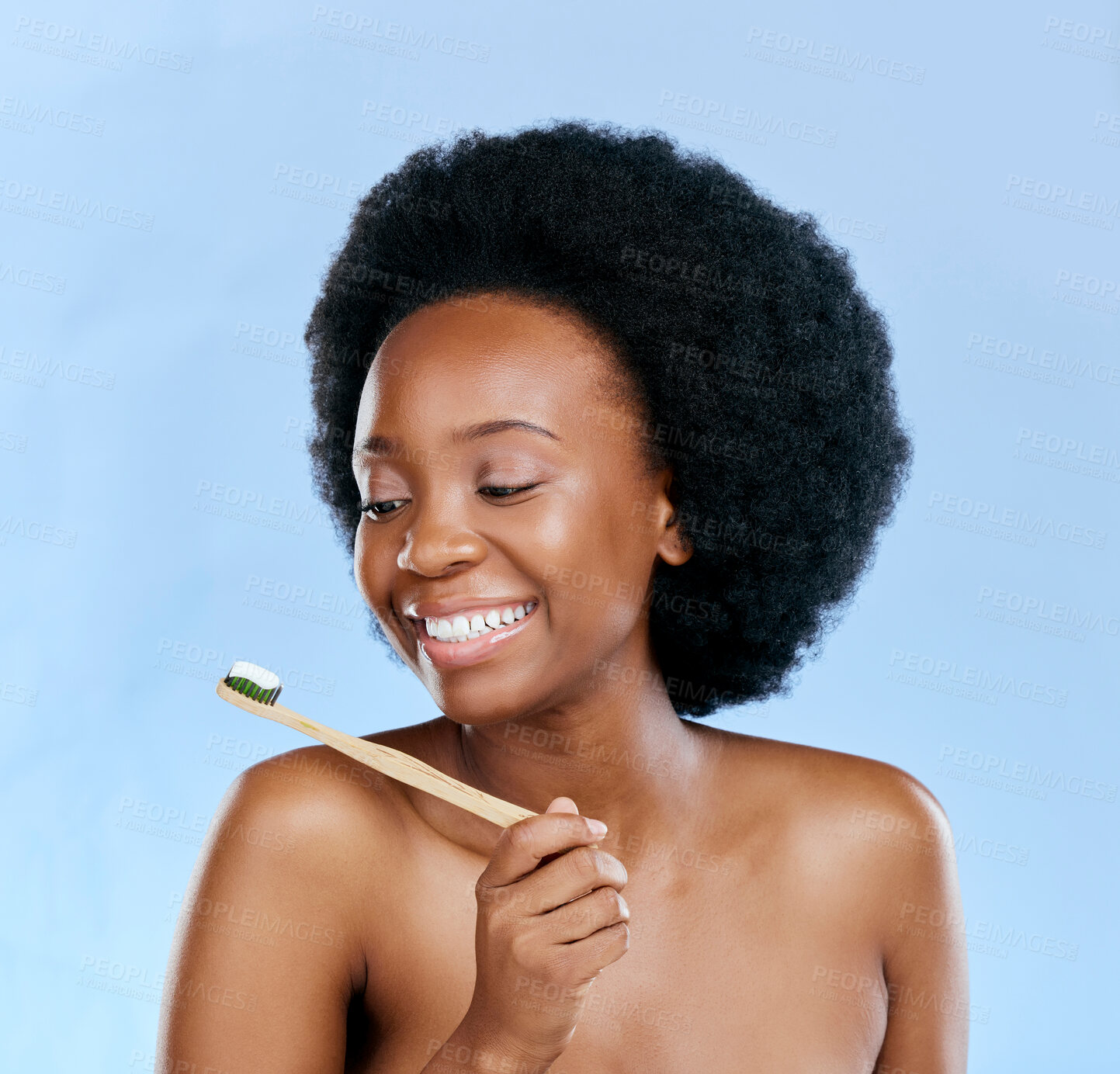 Buy stock photo Bamboo toothbrush, toothpaste and black woman smile in studio isolated on a blue background. Dental, brushing teeth and model with natural, eco friendly or healthy wood, oral hygiene and cleaning.