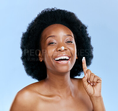 Buy stock photo Black woman, portrait and cream on nose, beauty and skincare cosmetics on blue background. Moisturizer, lotion and product for skin with glow and happiness, female model and dermatology in studio