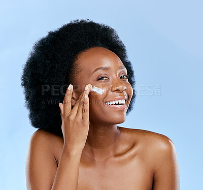 Buy stock photo Black woman, face and cream, beauty and cosmetic care with smile and skincare on blue background. Moisturizer, lotion and product for skin with sunscreen and portrait, female model and dermatology