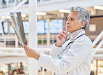 Xray, doctor or mature woman thinking of solution in hospital for healthcare research, results or analysis. MRI, exam check or senior medical worker planning for anatomy review or injury assessment 