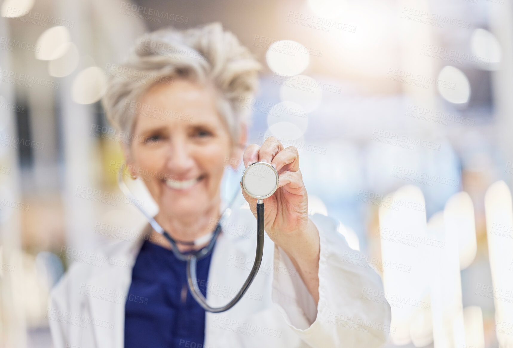Buy stock photo Portrait, health and stethoscope with an old woman doctor in the hospital for cardiology or treatment. Medical, heart care and wellness with a senior female medicine professional in a clinic