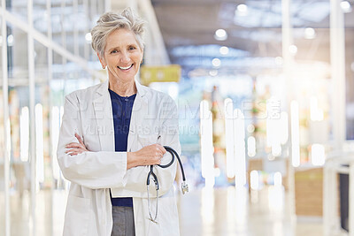 Buy stock photo Doctor, portrait and senior woman with arms crossed, happy and bokeh in hospital. Elderly surgeon, face and confident medical professional, expert or healthcare worker with stethoscope for cardiology