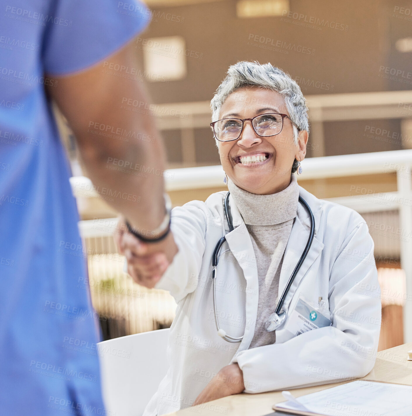 Buy stock photo Senior doctor, handshake and introduction, thank you and congratulations, smile and gesture with health. Welcome, communication and support in medicine, female medical professional and shaking hands