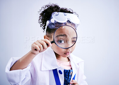 Buy stock photo Child, magnifying glass and portrait of a scientist girl in studio with eye for scientific research. Face of a African kid student with magnifier for medical science, education or biology experiment