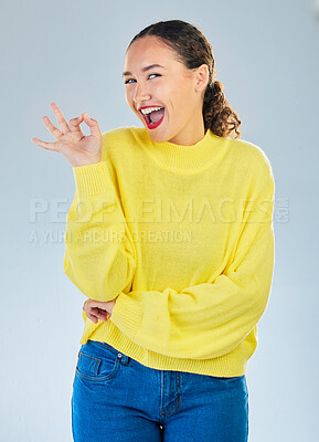 Buy stock photo Okay, excited portrait and woman in studio, white background and vote of good review. Happy female model show ok hands for success, agreement or icon for perfect, yes emoji or satisfaction of winning