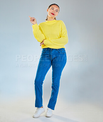 Buy stock photo Thinking, pointing and presentation with portrait of woman in studio for show, advertising and idea. Announcement, promotion and deal with person on grey background for space, news and mockup